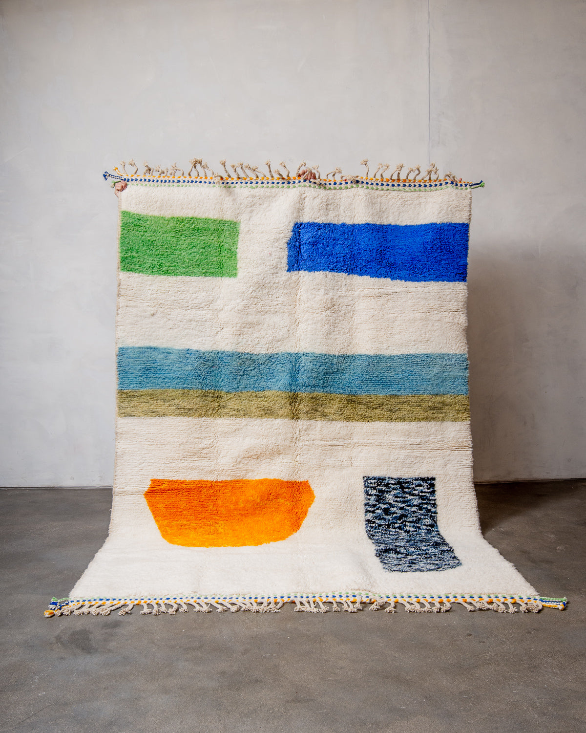 Modern, designer, handcrafted Berber rug from Morocco. Beniourain carpet with beautiful colours and patterns and fluffy wool texture.